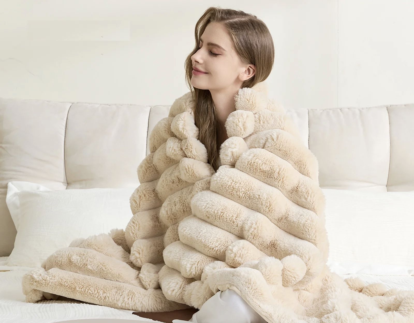 Cream faux-fur throw draped over a wooden chair in a bright, warm living room
